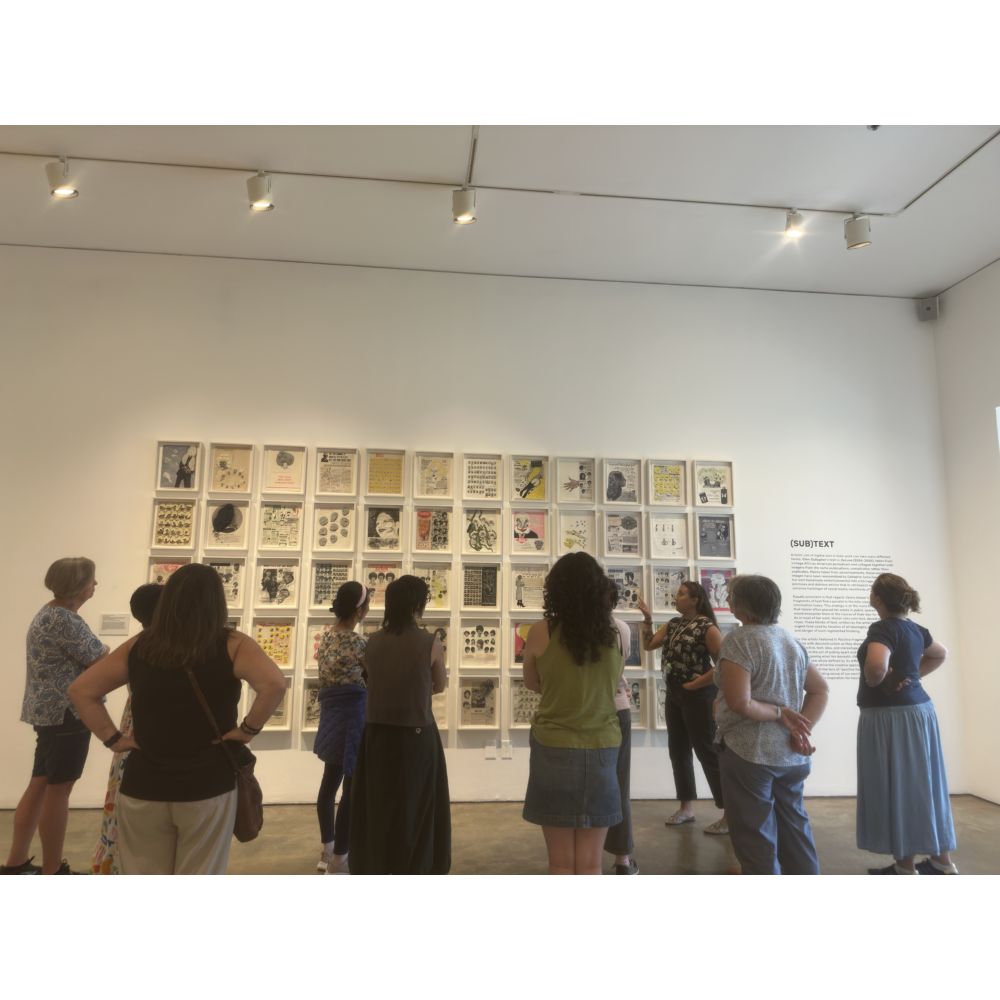 A group of docents having a chat about an artwork in the museum.