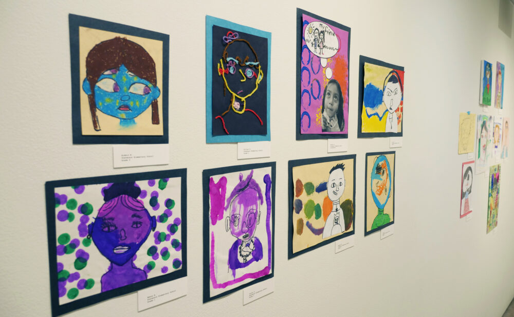 Colorful artwork by elementary school students displayed on the gallery walls of LBMA - John and Helen Apostle Foundation Youth Gallery