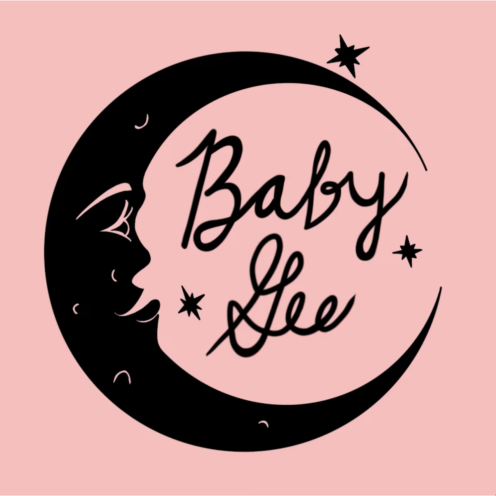 Logo reading ‘Baby Gee’ in flowing script, centered inside a black crescent moon with small star accents on a soft pink background.