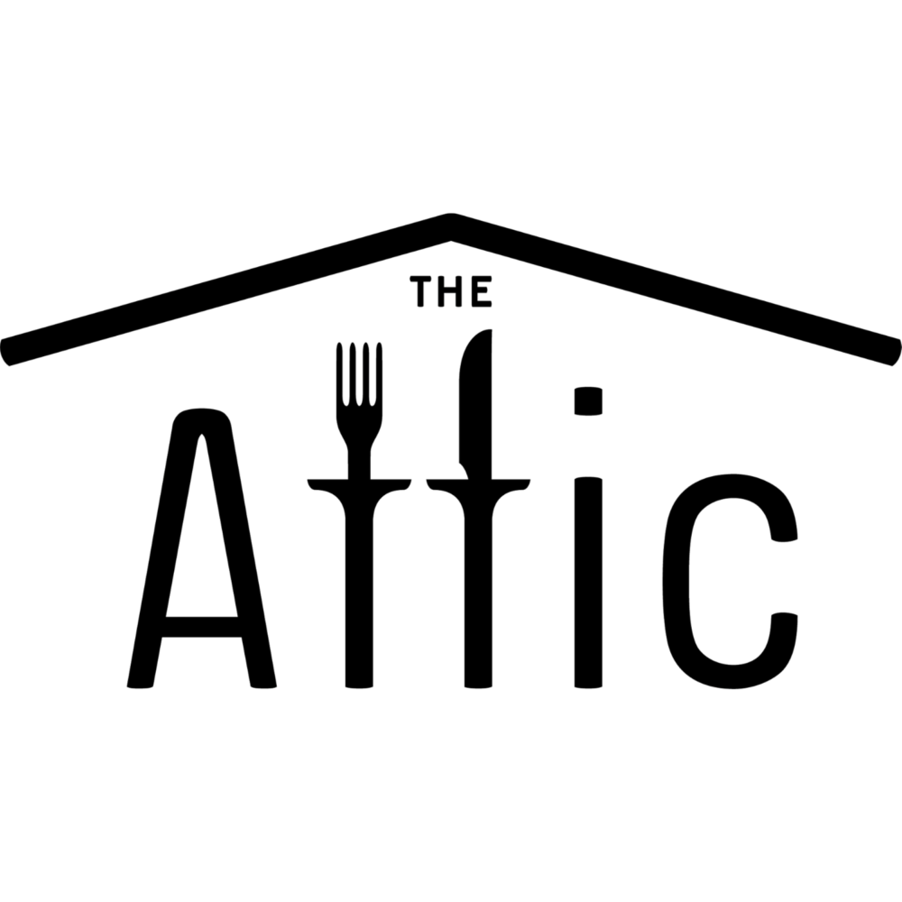 Logo reading ‘THE ATTIC’ in large, thin capital letters, with a simple line drawing of a pitched roof forming an attic shape above the text on a transparent background.